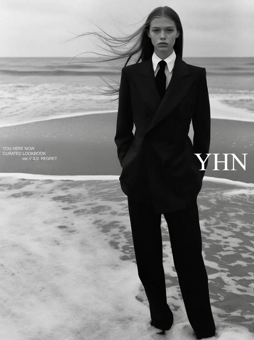 SS26 lookbook, Regret: a woman in a black suit standing in the surf, in black and white, with YHN lettering